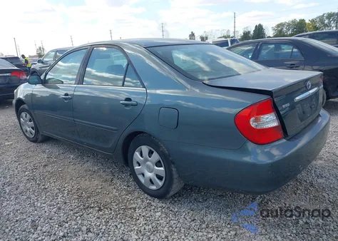 2002 Toyota Camry Le z USA, uszkodzony, nr VIN 4T1BE32K12U517129